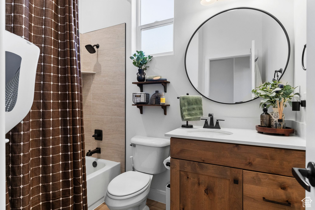 Full bath with vanity and shower / bath combination with curtain