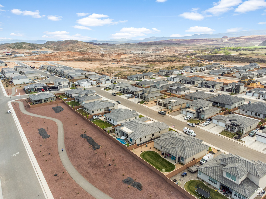 Aerial perspective of suburban area featuring a mountain backdrop