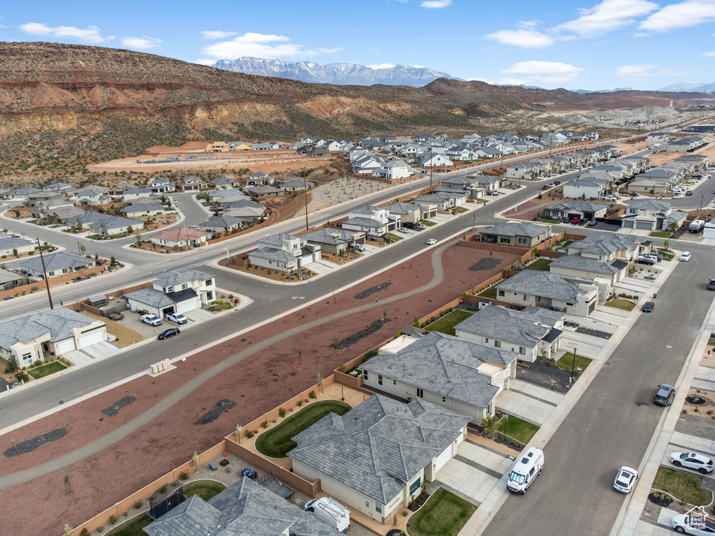 Aerial view of residential area featuring a mountainous background
