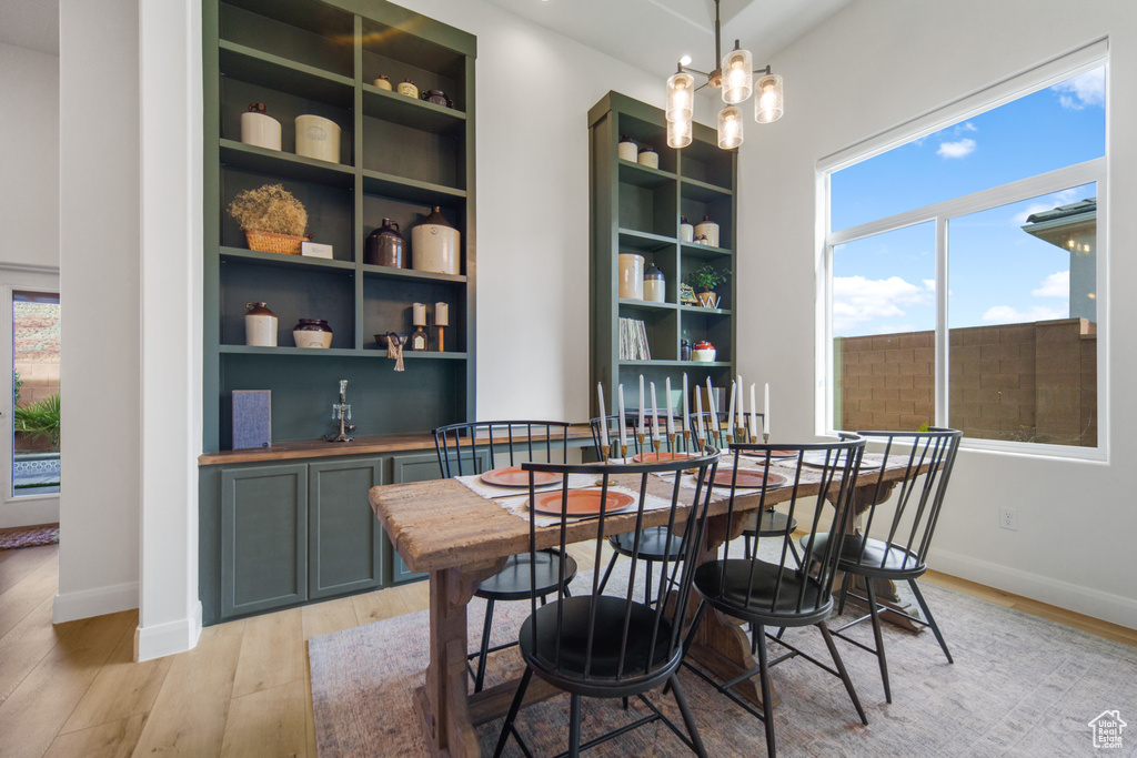 Dining space with light wood-type flooring and plenty of natural light