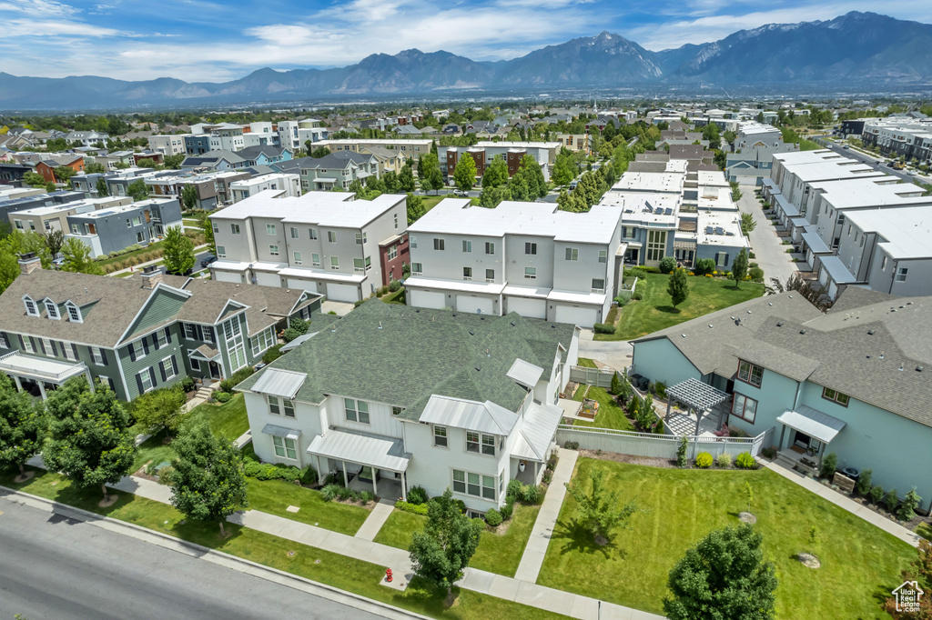 Aerial perspective of suburban area featuring a mountainous background