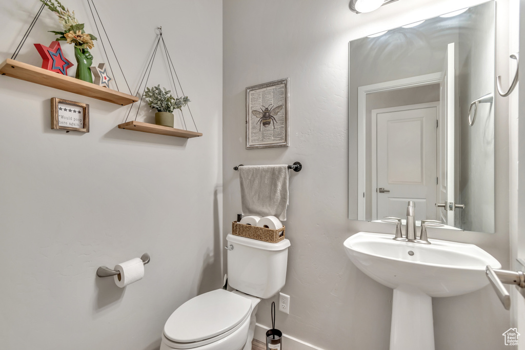 Bathroom featuring toilet and a sink