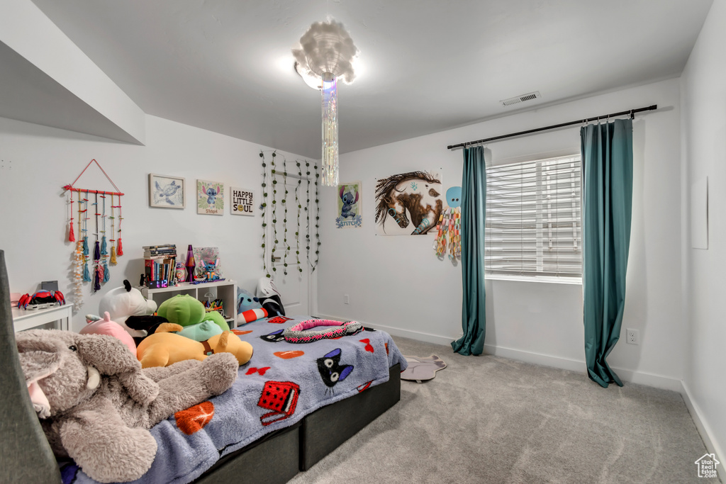 Carpeted bedroom with baseboards