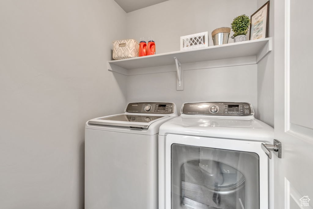 Washroom featuring washer and dryer