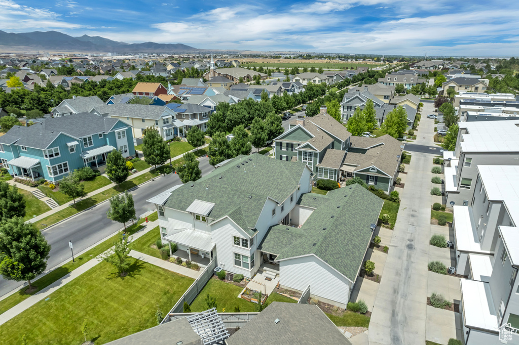 Aerial view of residential area featuring a mountain backdrop