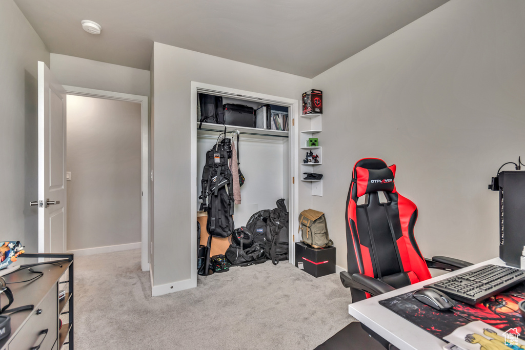 Carpeted office space with baseboards