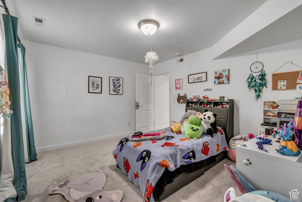 Bedroom with carpet and baseboards