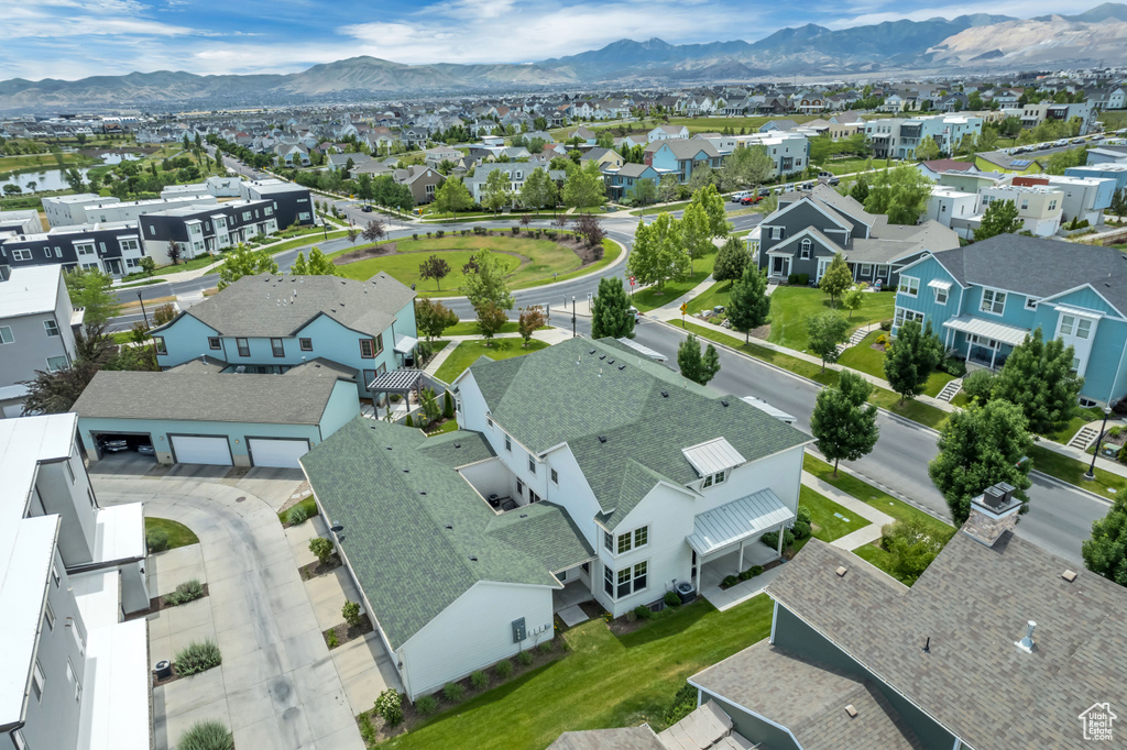 Aerial view of residential area featuring a mountain backdrop