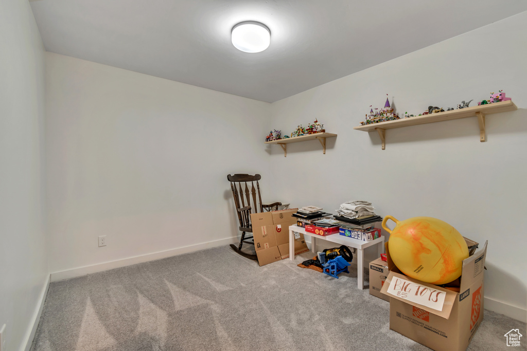 Miscellaneous room featuring carpet flooring and baseboards