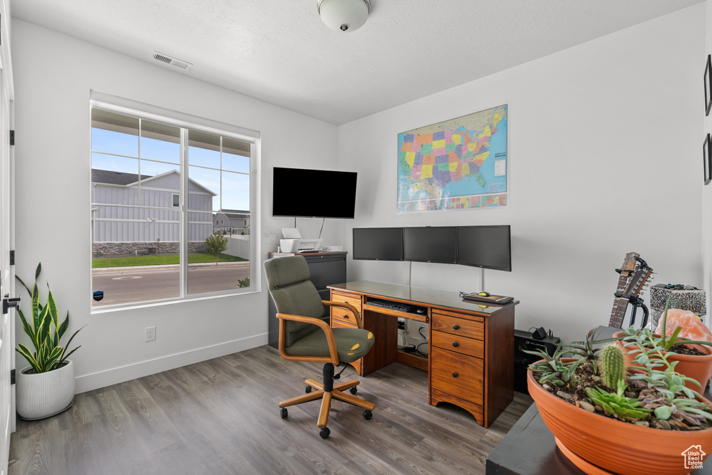 Office area with wood finished floors
