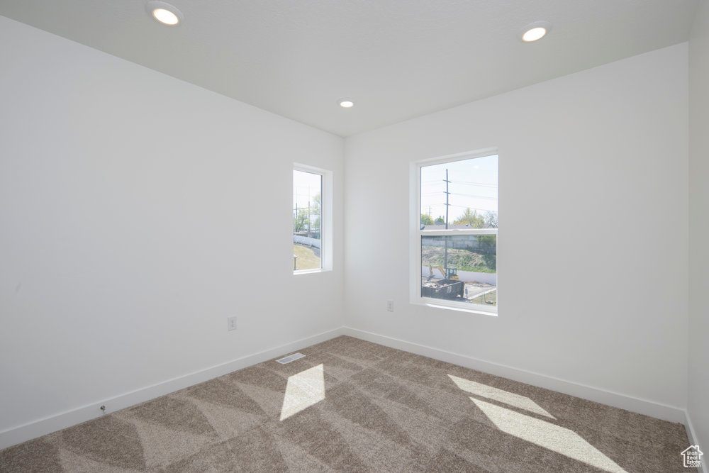 Spare room with carpet floors and recessed lighting