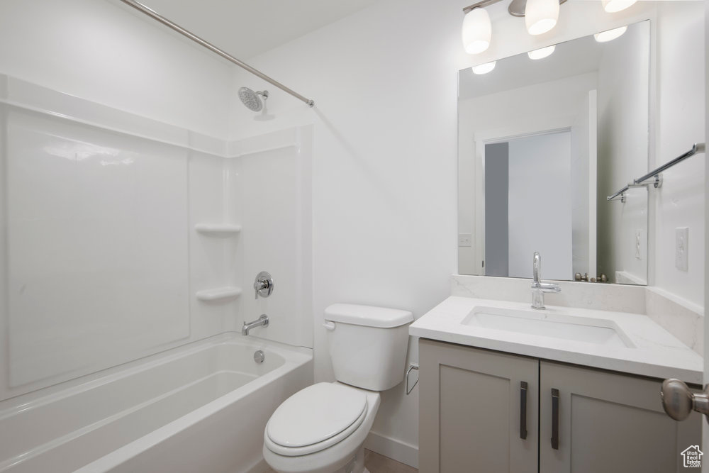 Bathroom featuring shower / bathtub combination and vanity