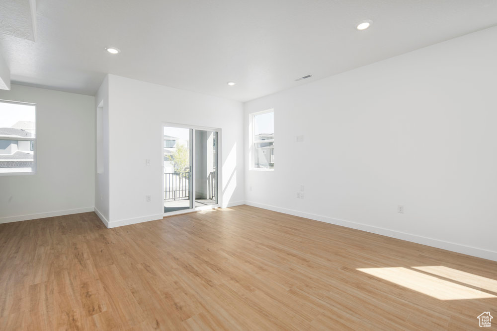 Spare room with light wood-style flooring and recessed lighting