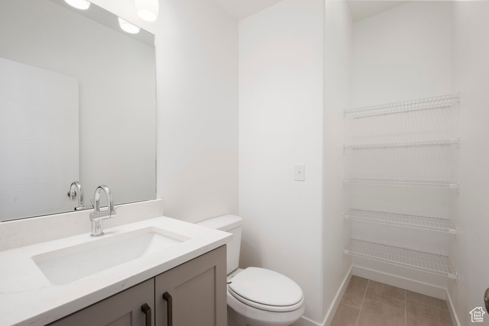 Bathroom with vanity and tile patterned floors