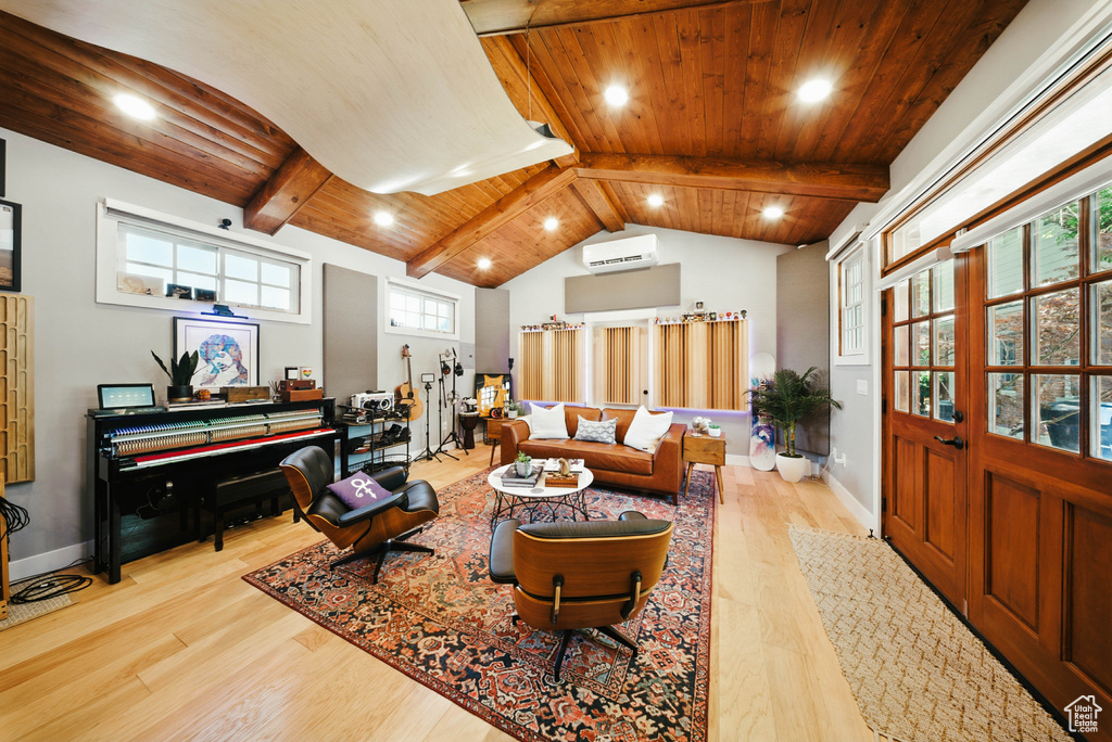 Living area with a wall unit AC, wood finished floors, wood ceiling, and recessed lighting
