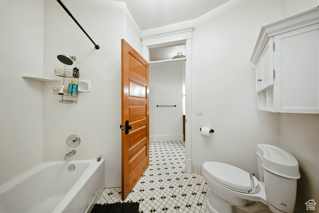 Full bathroom featuring tub / shower combination and tile patterned floors