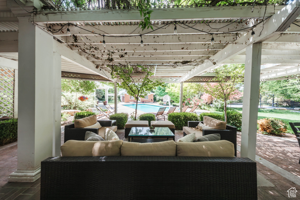 View of patio featuring an outdoor living space, an outdoor pool, and a pergola