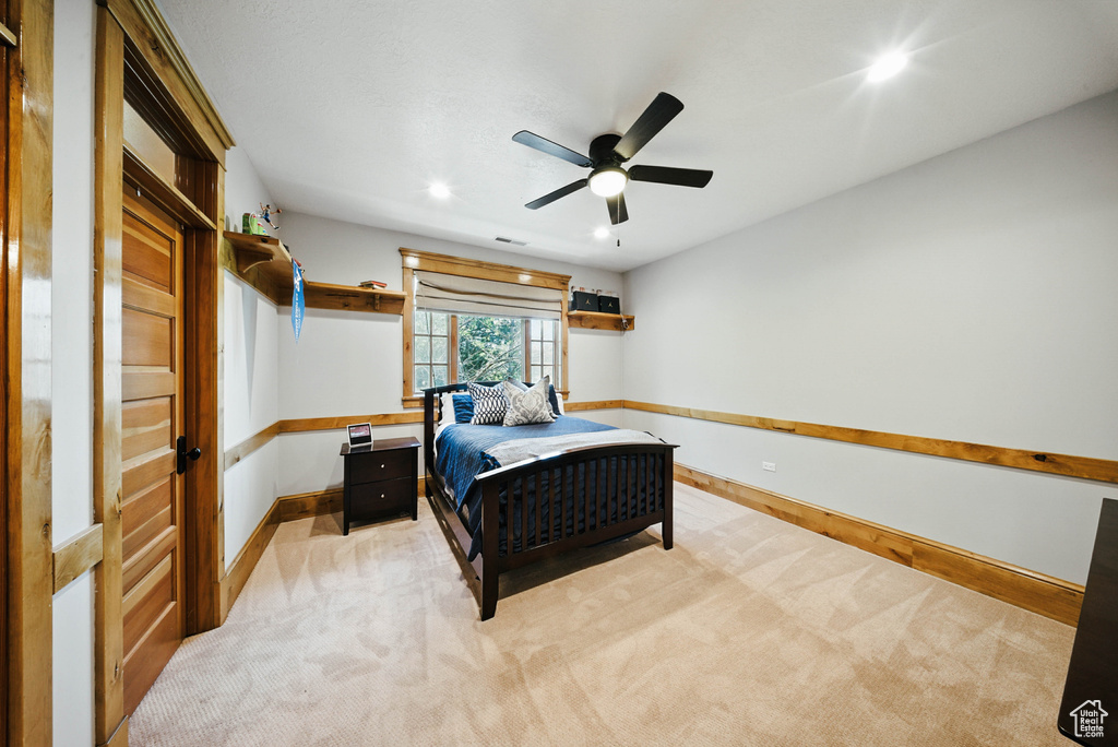 Bedroom featuring light colored carpet, recessed lighting, and ceiling fan