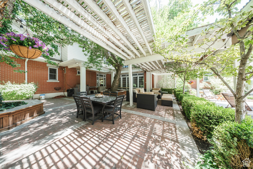 View of patio / terrace with outdoor lounge area, a pergola, and outdoor dining area