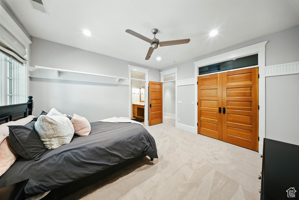 Bedroom featuring carpet floors, recessed lighting, ceiling fan, and ensuite bath