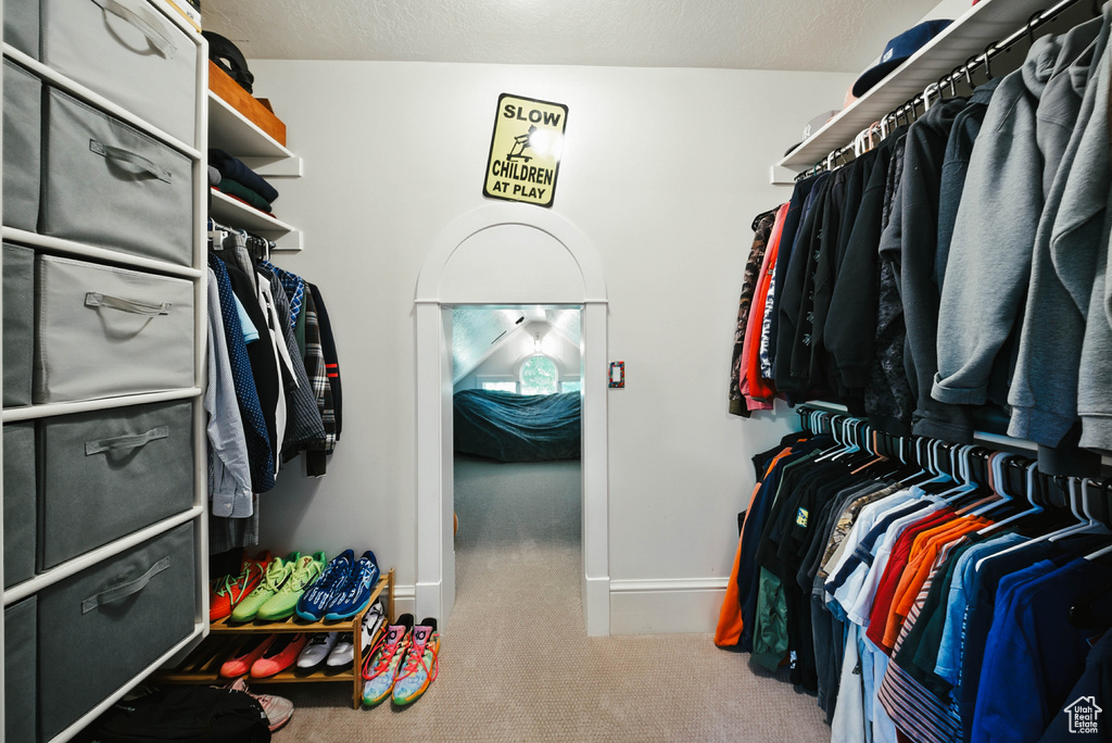 Walk in closet featuring carpet flooring