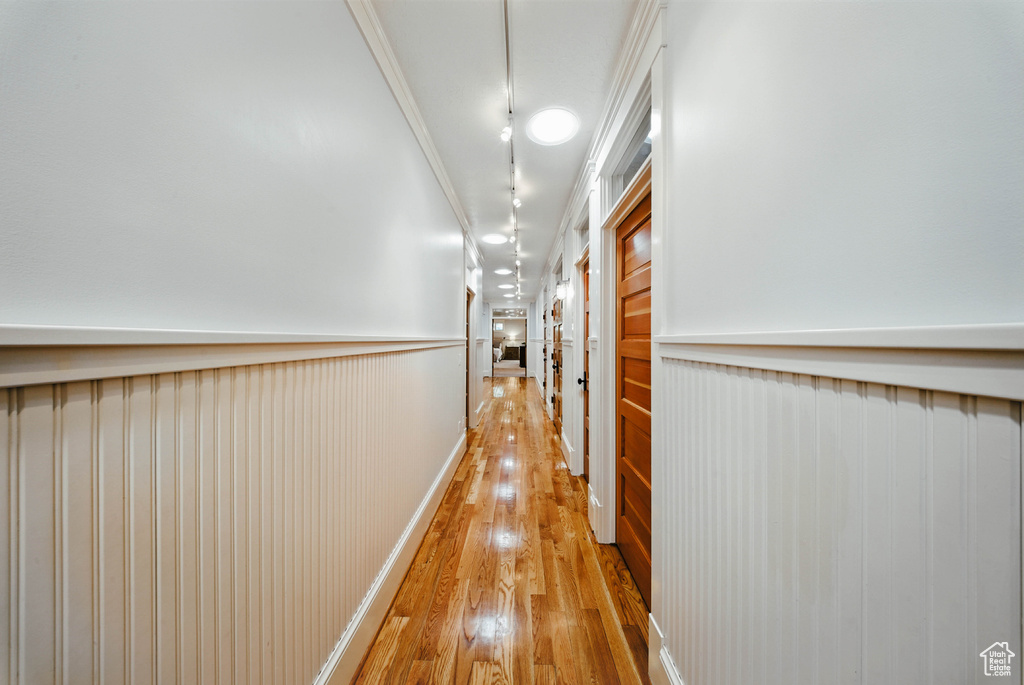 Hallway featuring light wood-style floors