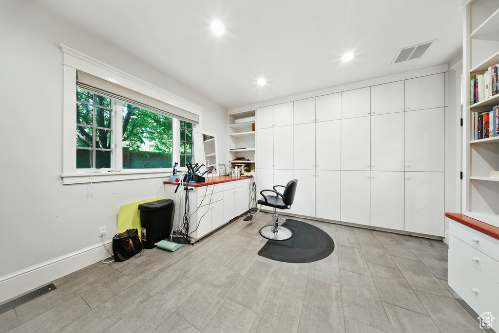 Office area featuring recessed lighting and light wood-style floors