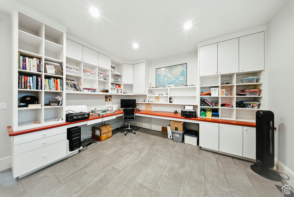 Office featuring built in desk and recessed lighting