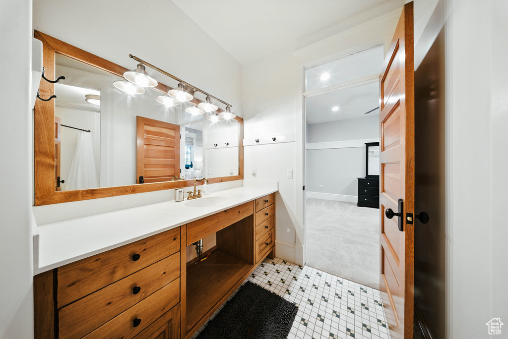 Bathroom with vanity and recessed lighting