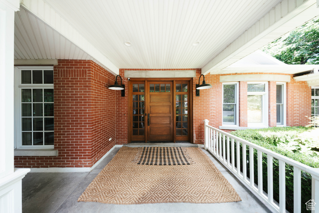 Entrance to property with brick siding