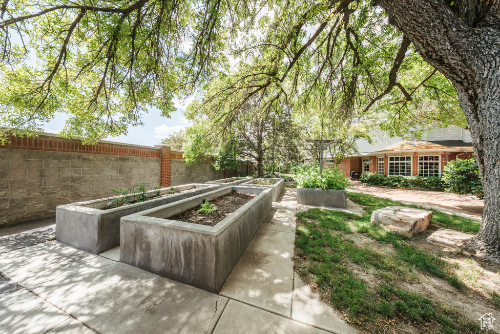 View of patio with a garden