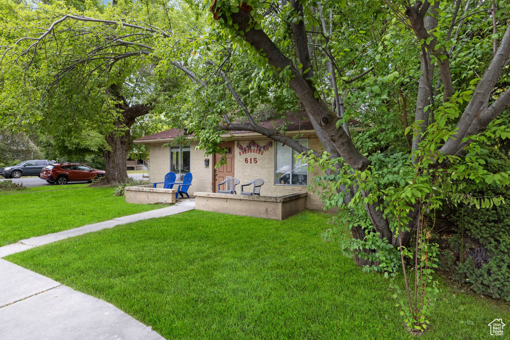 View of front of house with a front yard