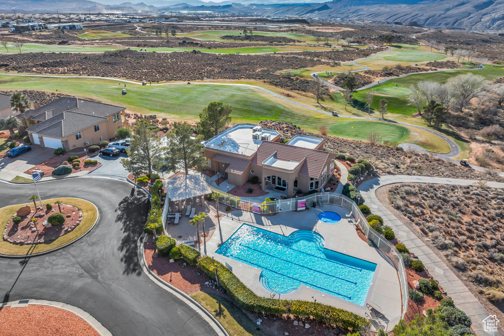 Drone / aerial view of mountains and a golf club