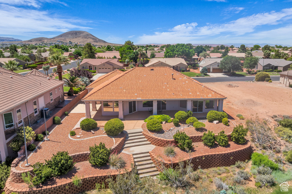 Aerial view of residential area featuring a mountain backdrop