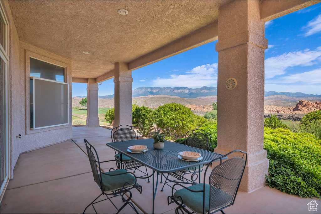 View of patio / terrace featuring a mountain view and outdoor dining space
