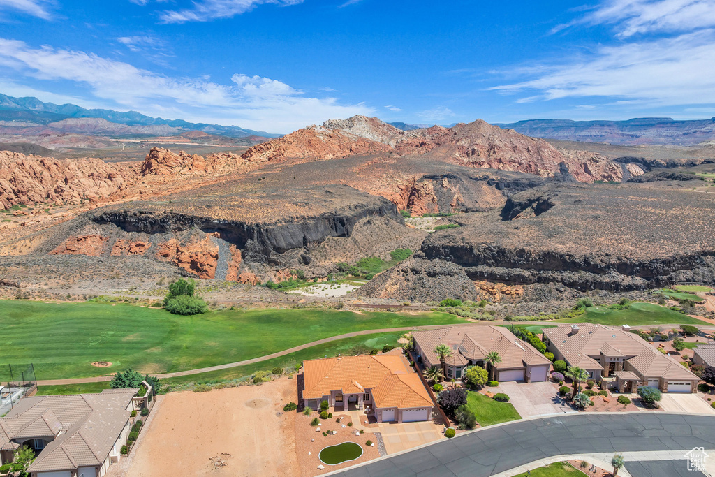 View of property location featuring a mountain backdrop and nearby suburban area