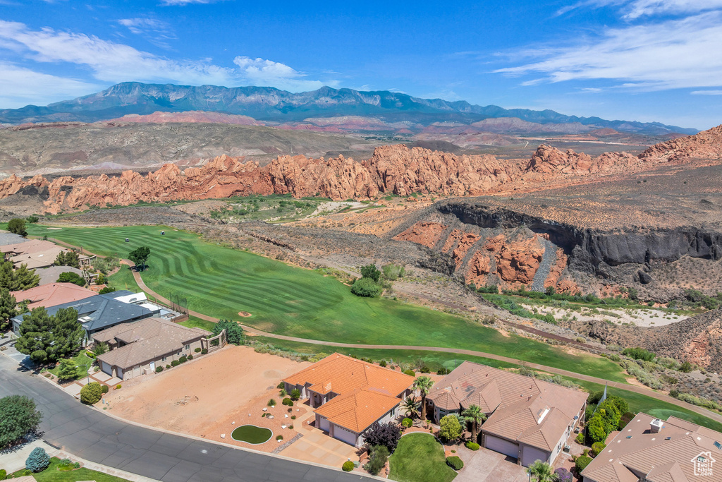 Aerial view of residential area featuring a mountain backdrop