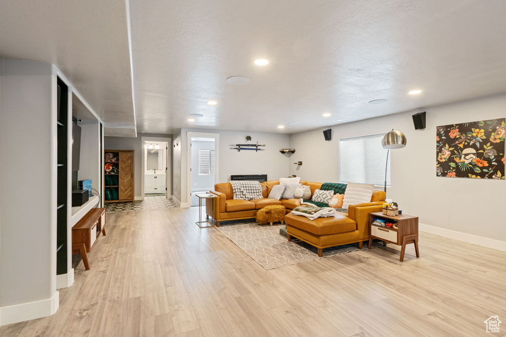Living room featuring light wood-style floors and recessed lighting