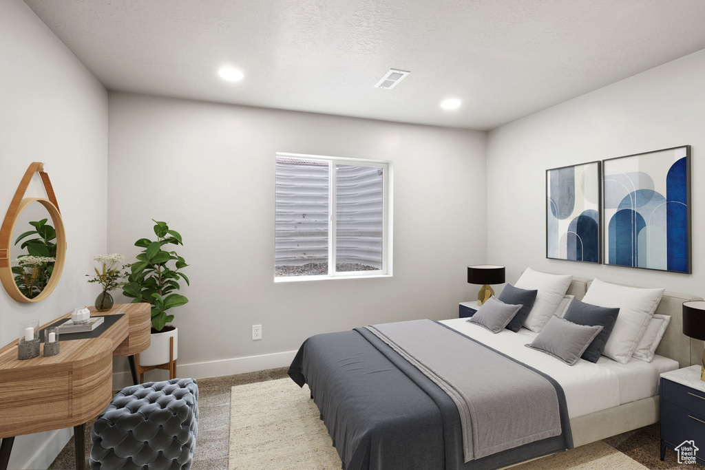 Carpeted bedroom featuring recessed lighting