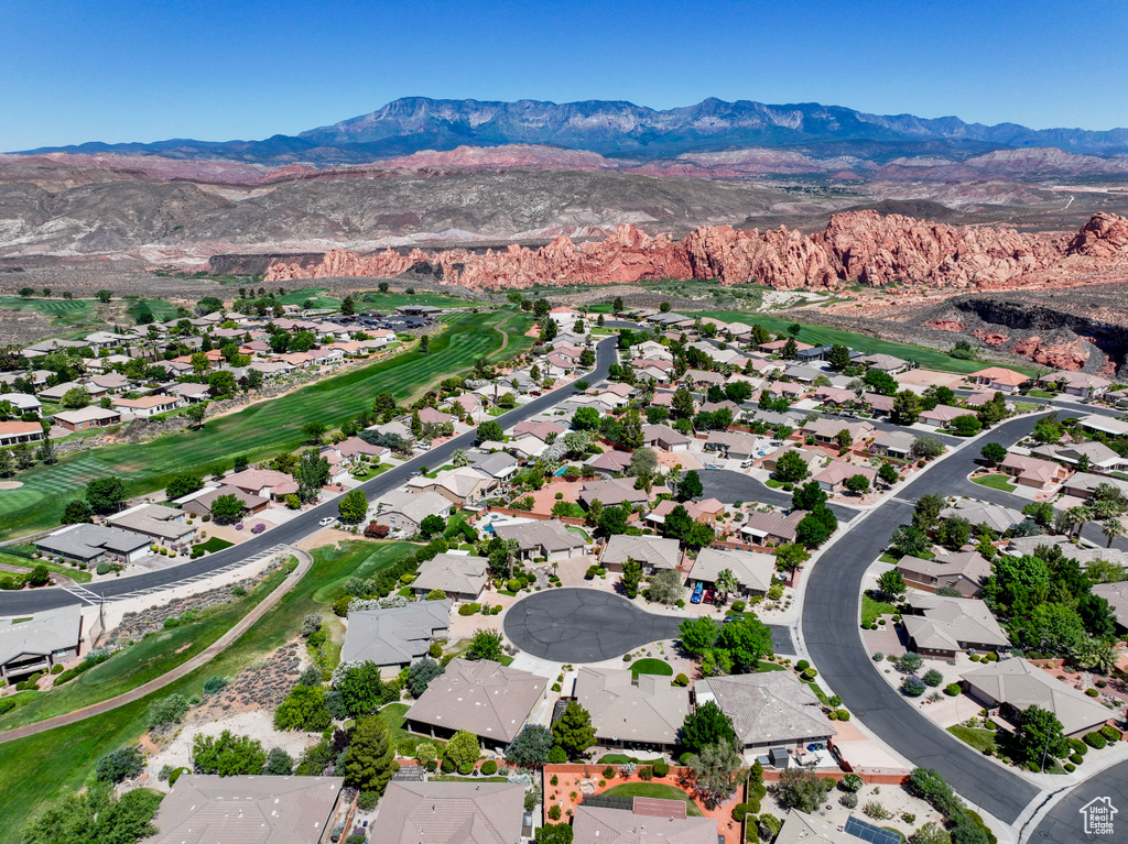 Aerial view of residential area featuring mountains