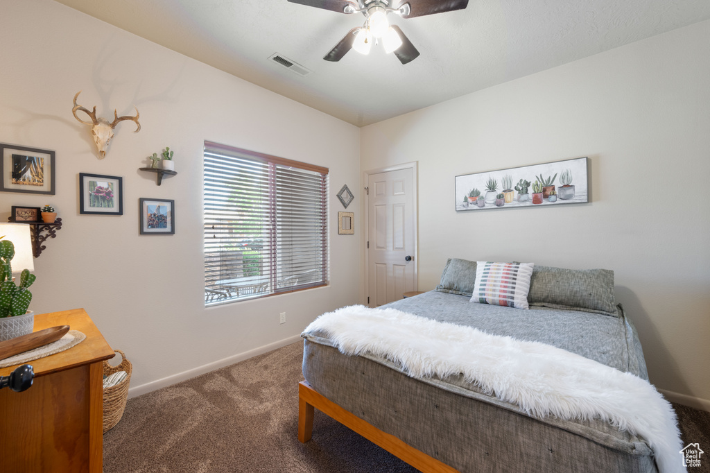 Bedroom with carpet flooring and ceiling fan