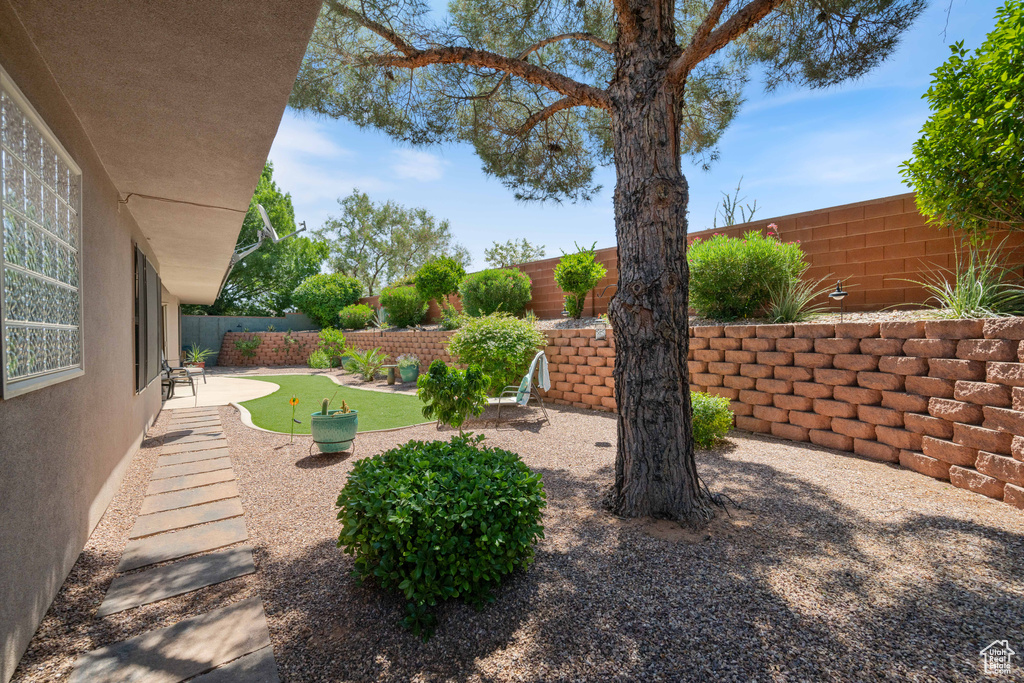 Fenced backyard featuring a patio