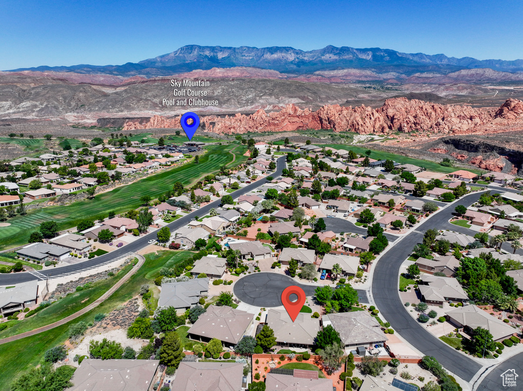 Aerial view of residential area with a mountainous background
