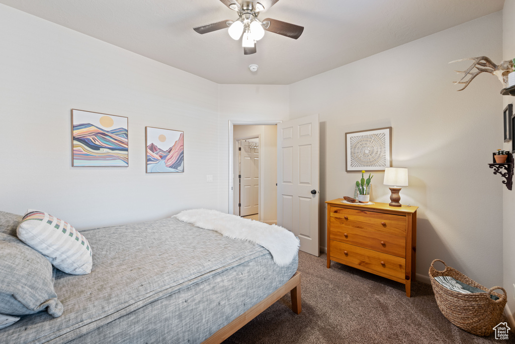 Bedroom featuring carpet and ceiling fan