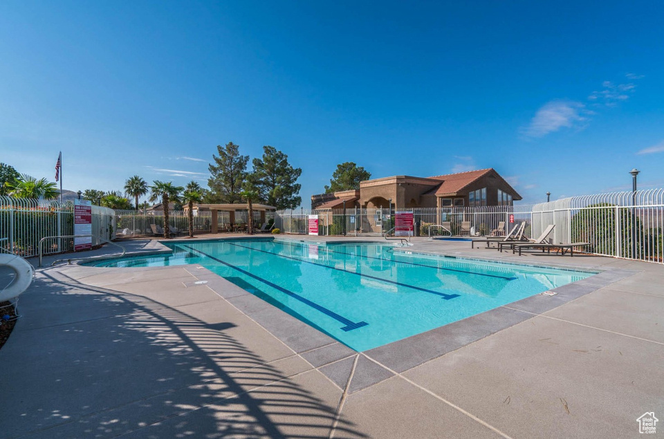 Community pool with a patio
