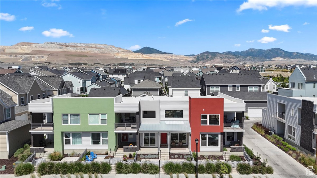 Aerial view of residential area with a mountainous background