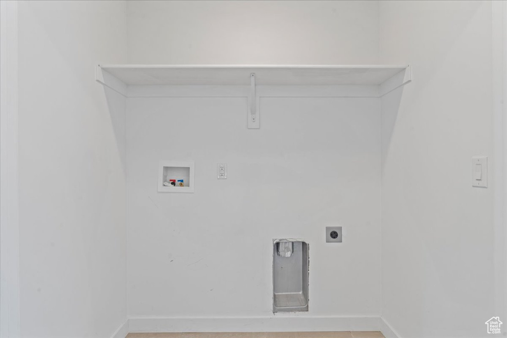 Laundry area with hookup for a washing machine and hookup for an electric dryer