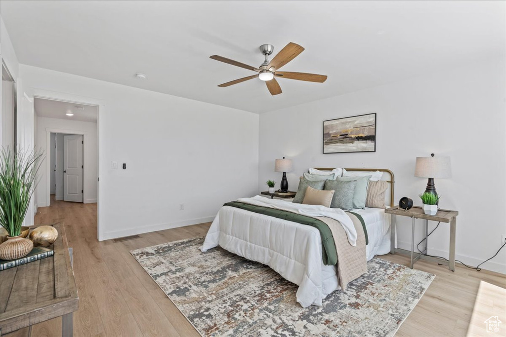 Bedroom featuring light wood-style floors and a ceiling fan