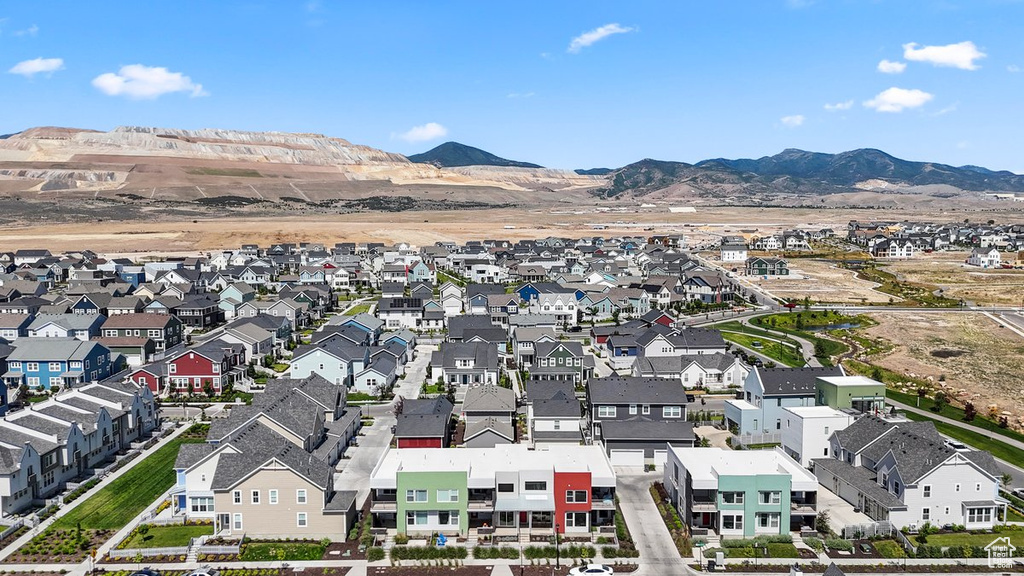 Aerial view of residential area featuring a mountainous background