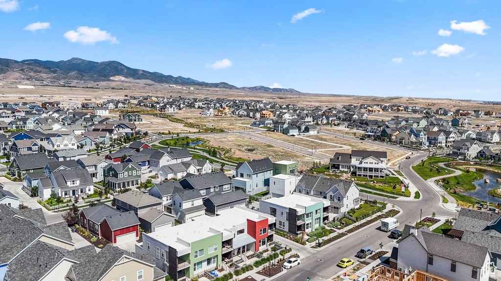 Aerial view of residential area with a mountainous background